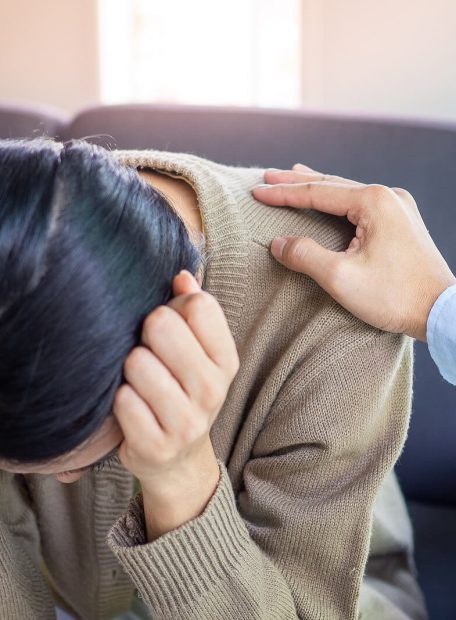 Woman holding head in Accelerated Resolution Therapy in Georgia.